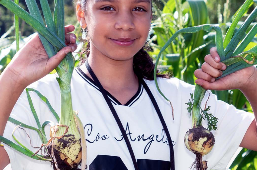 meisje met uien voorkant Handboek Schooltuinen